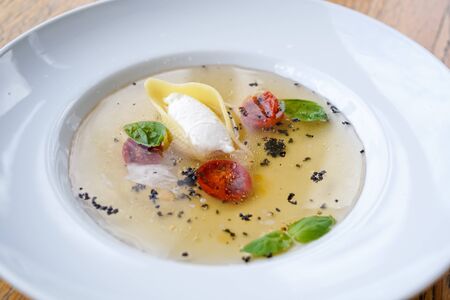 Pasta dish on a restaurant tableの写真素材