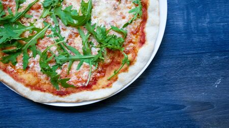 Pizza on a restaurant tableの写真素材
