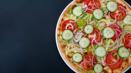 Pizza on a restaurant tableの写真素材