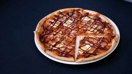 Pizza on a restaurant tableの写真素材