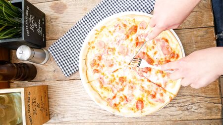 Pizza on a restaurant tableの写真素材