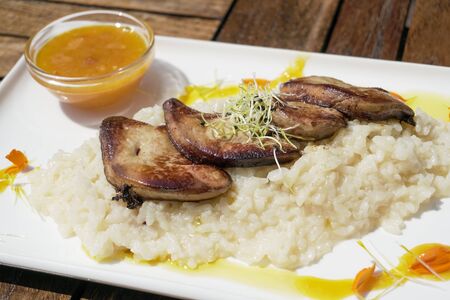 Pork dish on a restaurant tableの写真素材