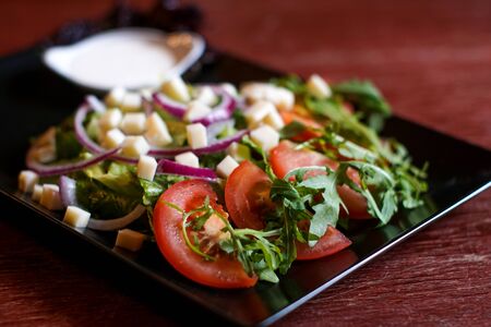 Salad on a restaurant tableの写真素材