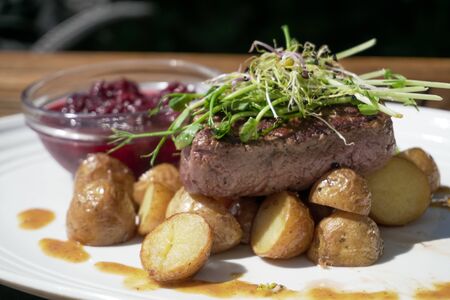Steak on a restaurant tableの写真素材