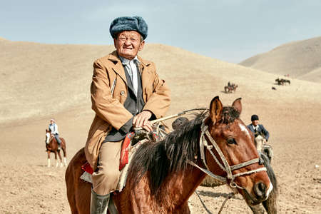 Uzbekistan, Parkent-08/03/2019: Ulak-Kupkari (buzkashi) -traditional horse riding competition in...