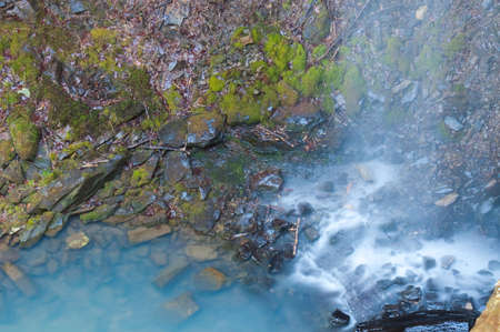 Waterfall Crashing Into An Emerald Pool Belowの写真素材