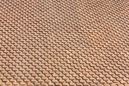 Brown roof tile pattern (background) on sunset lightの写真素材