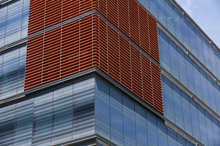 Office building with facade made by glass and wood