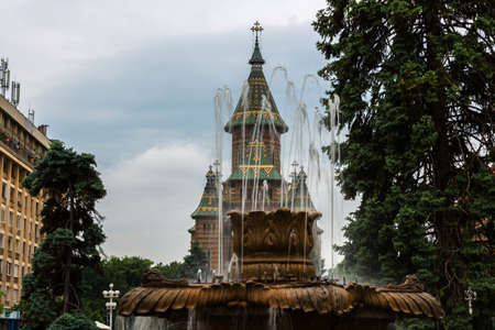 Down town of Timisoara with fountain and cathedral in the backgroundの写真素材