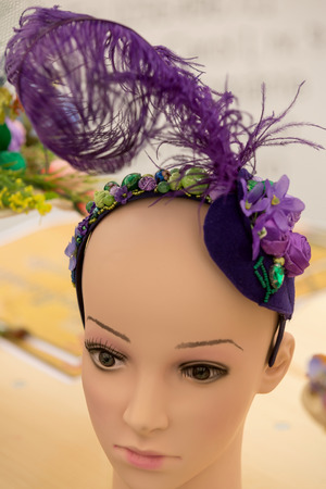 Hat with natural and artificial spring flowersの写真素材