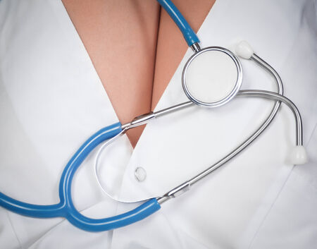 Stethoscope on background of woman sexy hips doctorの写真素材