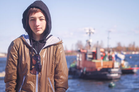 Portrait of a female on the background of the streetの写真素材