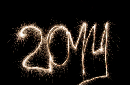 New Year 2014 written of sparklers on black background