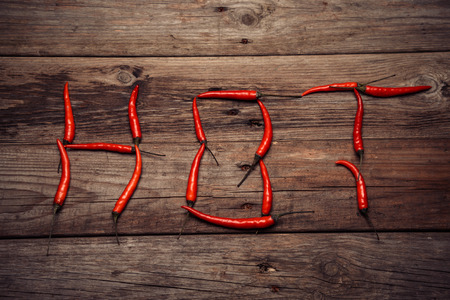 Red chili peppers in the form of word of hotの写真素材