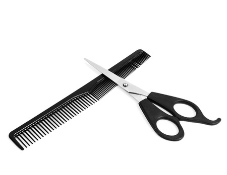 Comb and scissors on white の写真素材