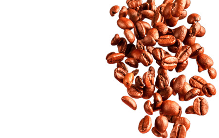 Falling coffee beans on a light/white の写真素材