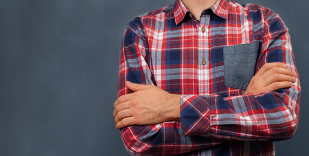 Unrecognizable man in shirt standing near the blackboard, space for textの写真素材