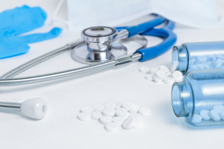 Close-up of a stethoscope and tablets.の写真素材