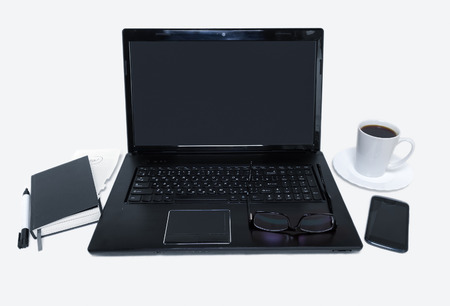 workplace computer, pen and diary, coffee on the white tableの写真素材
