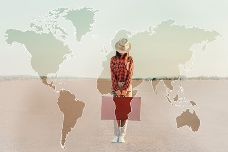 Double exposure map of world combined with image of traveler woman with suitcase on road. Concept of...