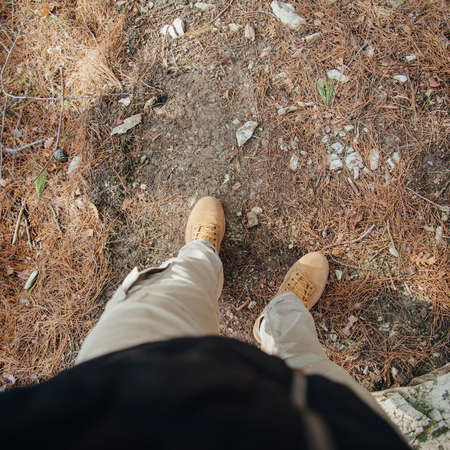 Man walking on path outdoor, view of legs. Point of view shotの写真素材