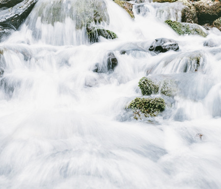 Close-up detail of splashes mountain river, water background.の写真素材