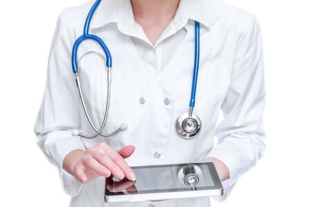 Female doctor holding tablet PC on white backgroundの写真素材