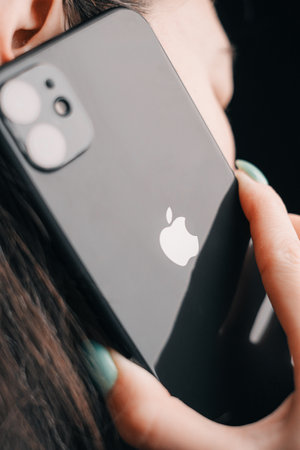 Gelendzhik, Russia, 24 March 2021: The woman makes phone calls using an iPhone 11 black color.のeditorial素材