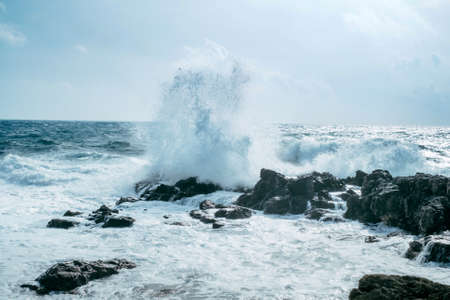 Powerful blow of the sea waveの写真素材