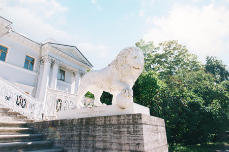 Statue of a white lion near the main entrance to the Elagin Palace.のeditorial素材