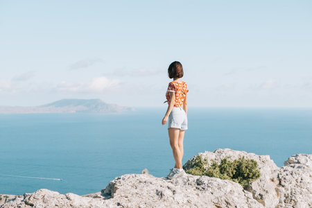 Happy free woman enjoy the sea view.