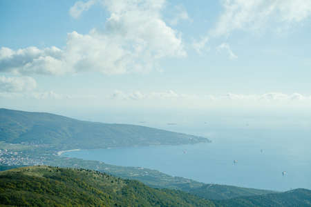 Landscape on the sea bay with ships and mountains.の写真素材