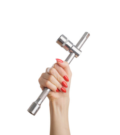 Female hand with wrench wheel in hand.の写真素材