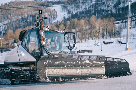 Close up of the Snowcat Prinoth Caterpillar vehicle for maintenance of mountain ski slopes.のeditorial素材