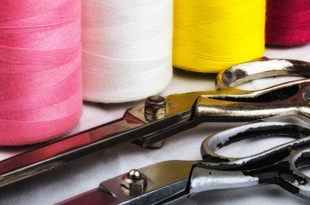 Sewing colored threads and scissors.