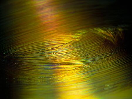 Horizontal abstract image of very gold and colored lines