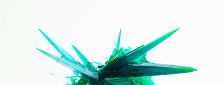 large green copper chloride crystals. green crystal needles. collector's mineral. on white backgroundの写真素材