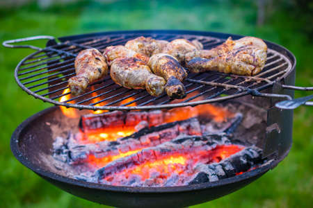 grilling chicken thighs. grilling in the garden.の写真素材
