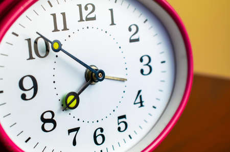 Mechanical hand clock white dial. Spring alarm clock.の写真素材