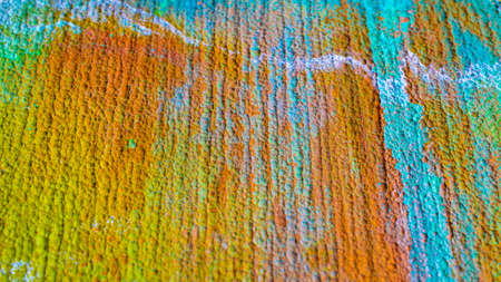 Oxidized etched copper, abstraction. Natural orange, blue. green yellow background with patina rusty copper plateの写真素材