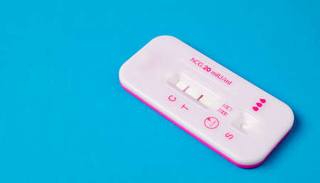 pregnancy test. home test on a pink blue background.