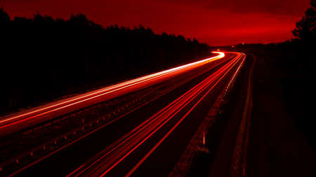 Night road lights. Lights of moving cars at night. long exposure multicolored