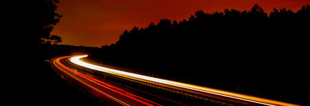 Night road lights. Lights of moving cars at night. long exposure multicolored