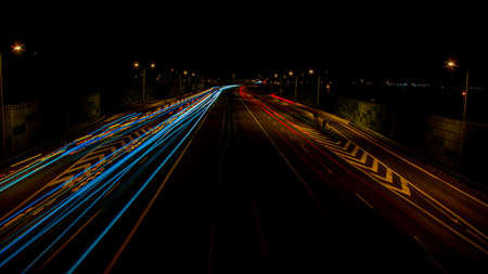 night highway, long exposure of cars lights on the night road
