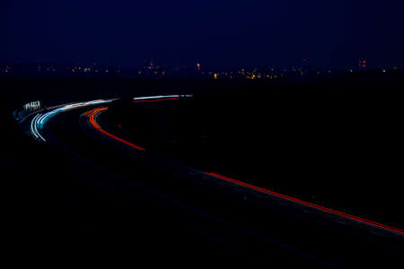Night road lights. Lights of moving cars at night. long exposure multicolored