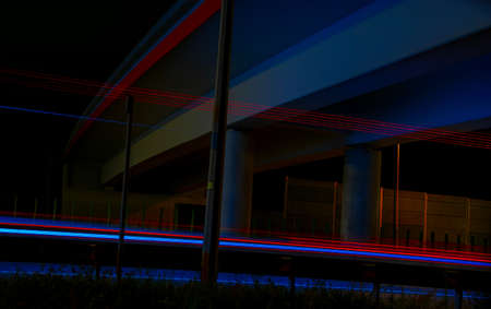 Night road lights. Lights of moving cars at night. long exposure red, blue, green