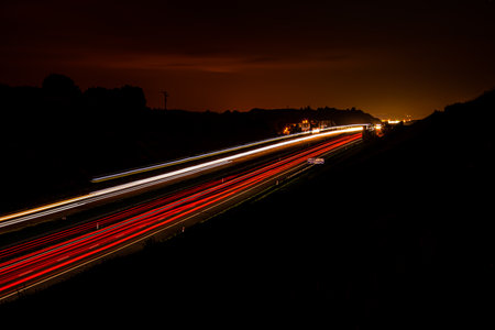 Night road lights. Lights of moving cars at night. long exposure red, blue, green