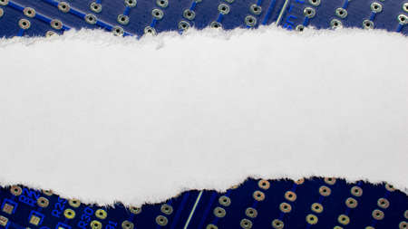 Blank white piece of paper on a printed circuit board background. Label for your individual text.