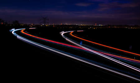 Night road lights. Lights of moving cars at night. long exposure red, blue, green