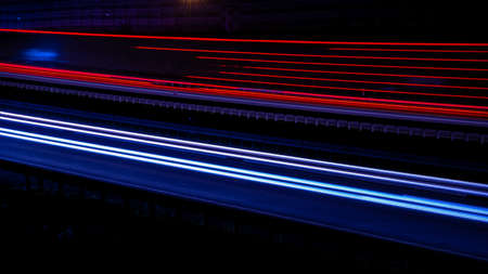Night road lights. Lights of moving cars at night. long exposure red, blue, greenの写真素材
